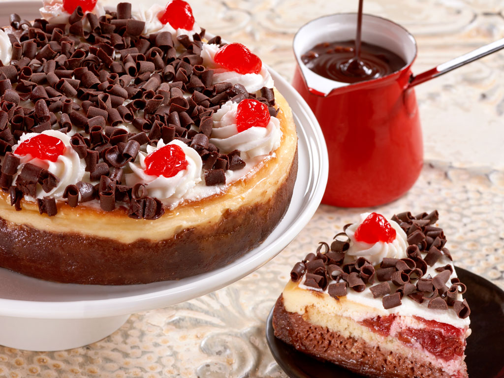 Yes, we keep the cherries on top! Delicious chocolate cheesecake is layered with cherry cheesecake and topped with whipped cream, chocolate curls and Marciano cherries. This delicious cheesecake arrives with a greeting card that you can personalize and is delivered in an elegant gift box. Order online for nationwide delivery!